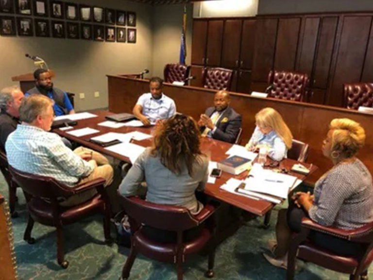 Clarksdale urban renewal — partnership meeting photograph published with the original bond financing announcement.